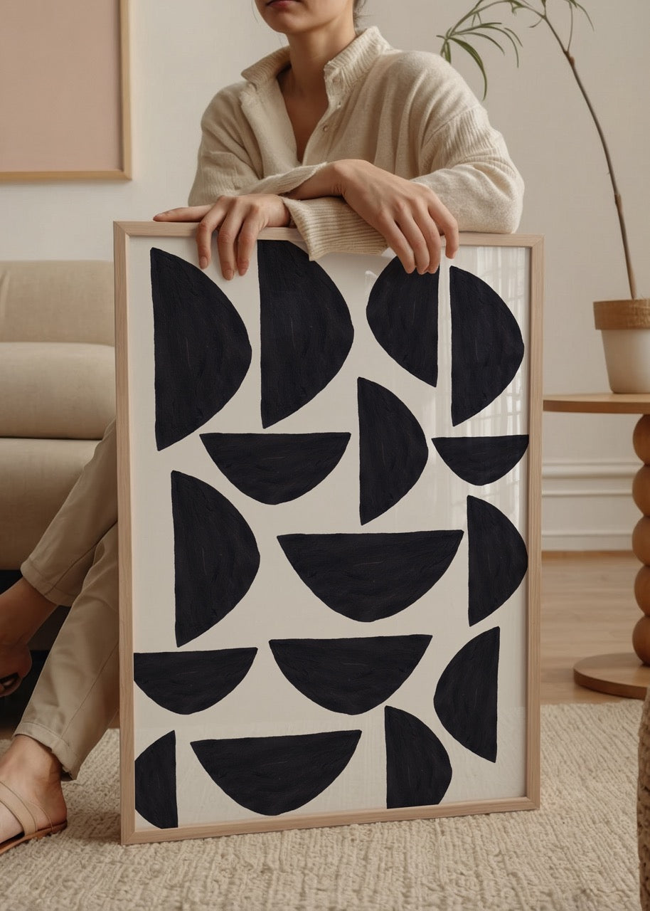 Monochrome geometric poster featuring black shapes on white background.