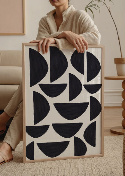 Monochrome geometric poster featuring black shapes on white background.