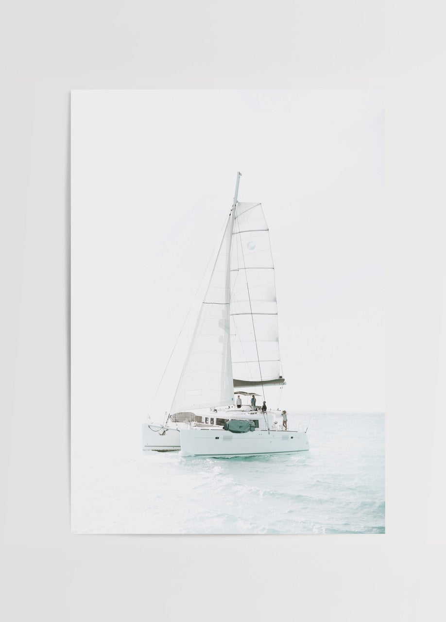 Minimalist artwork featuring a catamaran sailing on the ocean.