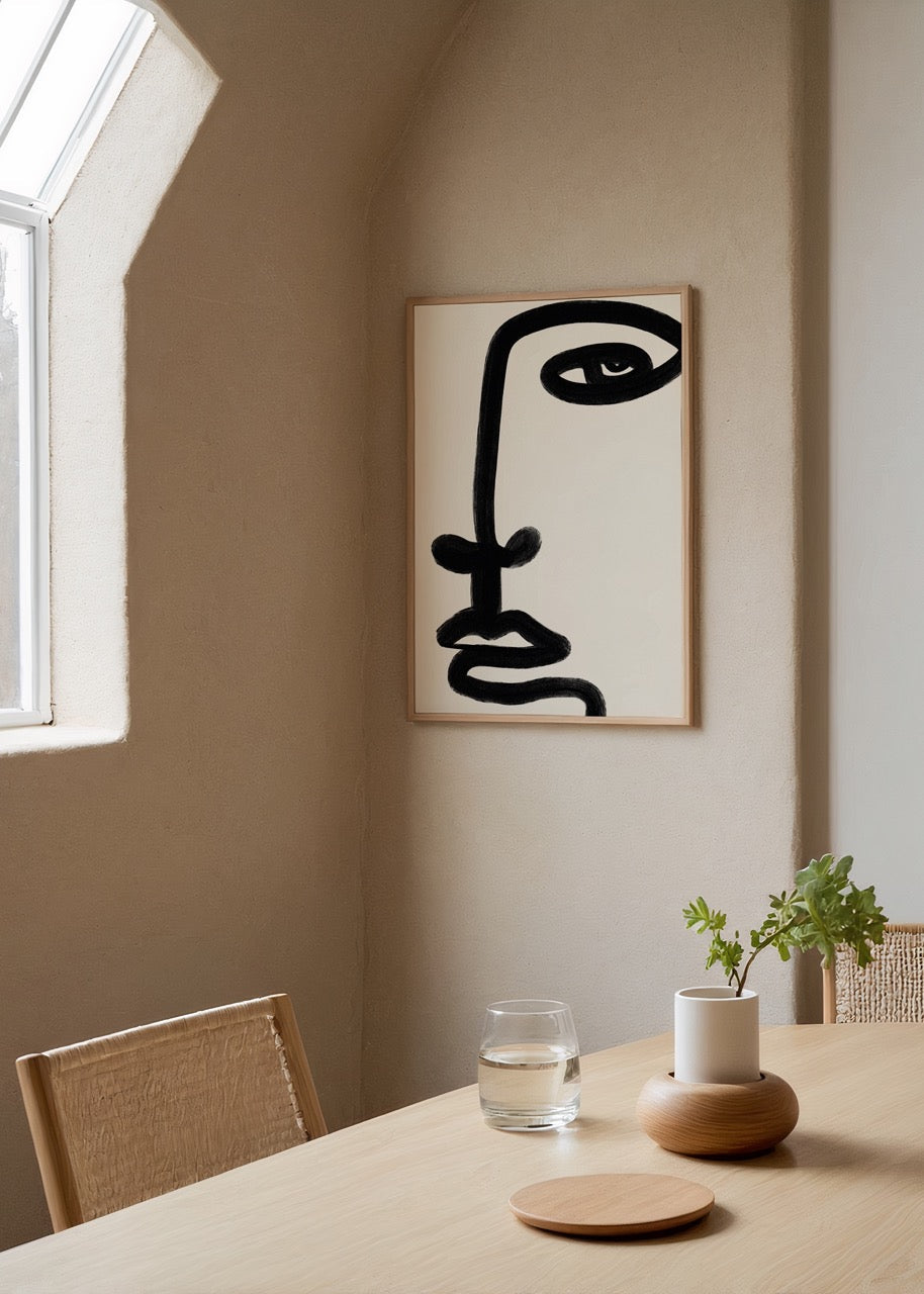 Bold minimalist face line art print on a white background.