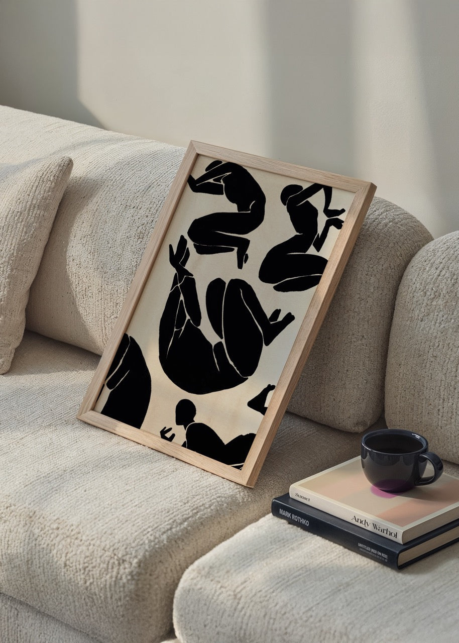 Abstract silhouette wall art featuring dynamic black figures on a beige background.