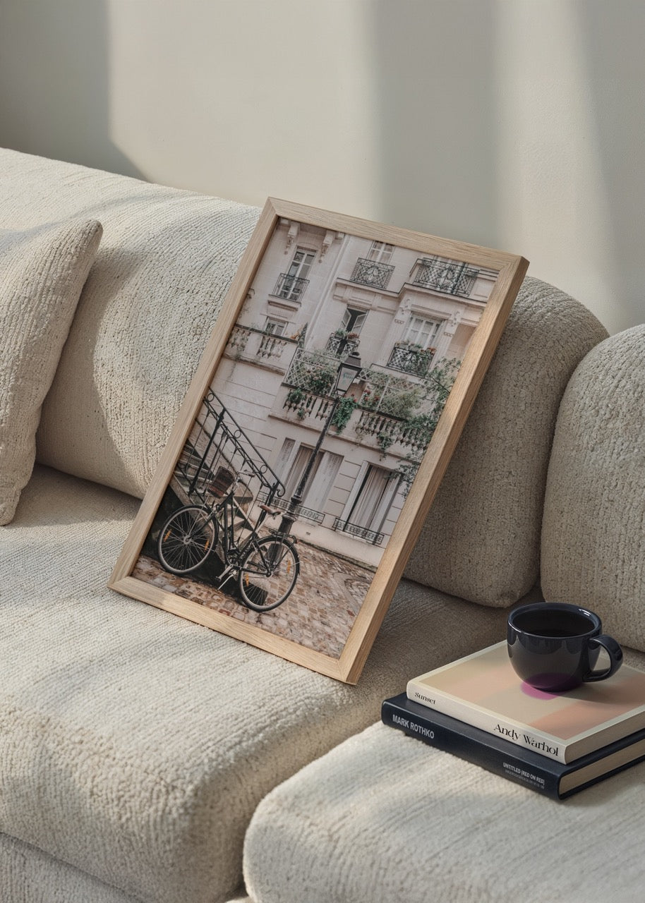 Vintage Parisian street scene with a bicycle and elegant architecture.