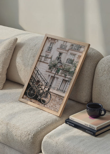 Vintage Parisian street scene with a bicycle and elegant architecture.