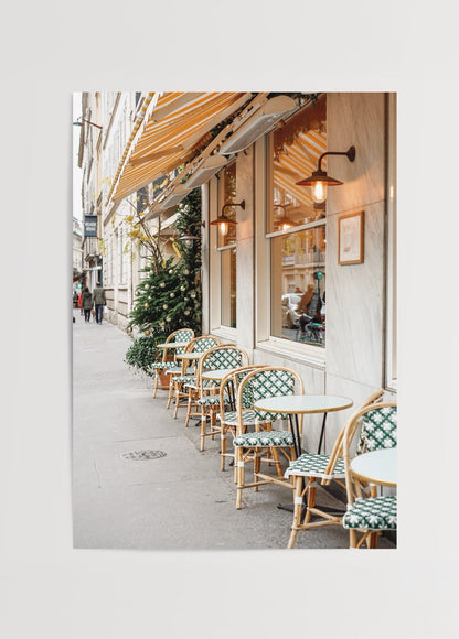 Charming Parisian outdoor cafe with elegant seating and greenery