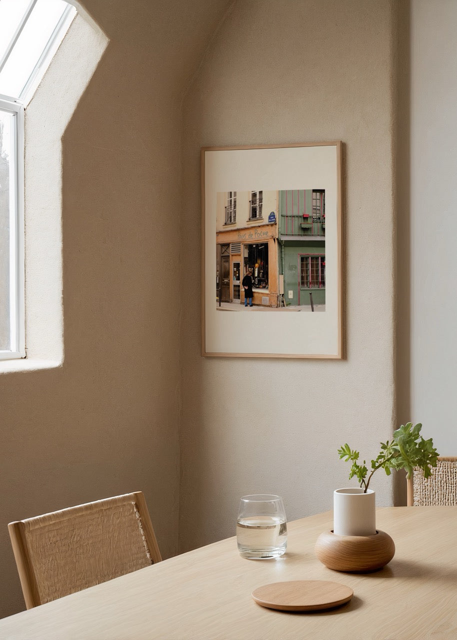 Photographic print of a quaint Paris storefront featuring soft hues.
