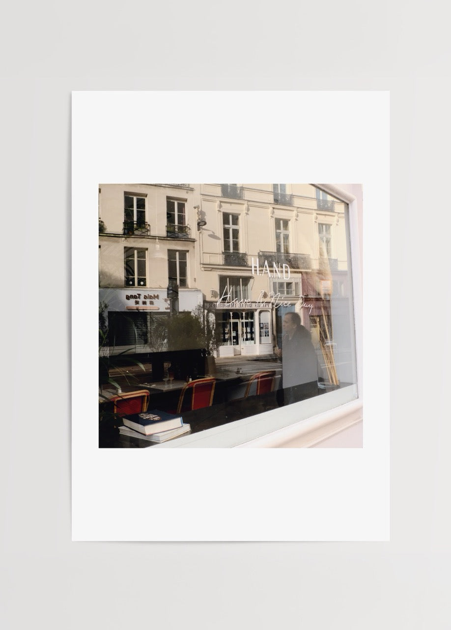 Paris Reflection Poster Print showcasing a café scene with reflections.