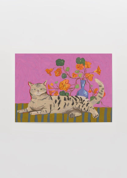 A playful cat lies among bright flowers on a pink background in this charming poster print.