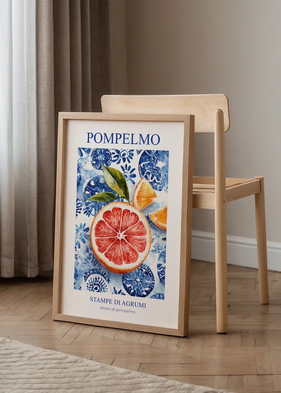 Vibrant grapefruit artwork with blue floral backdrop for kitchen decor.