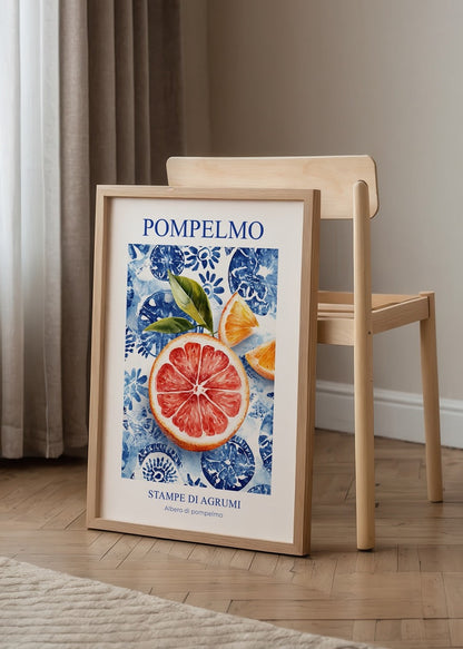Vibrant grapefruit artwork with blue floral backdrop for kitchen decor.