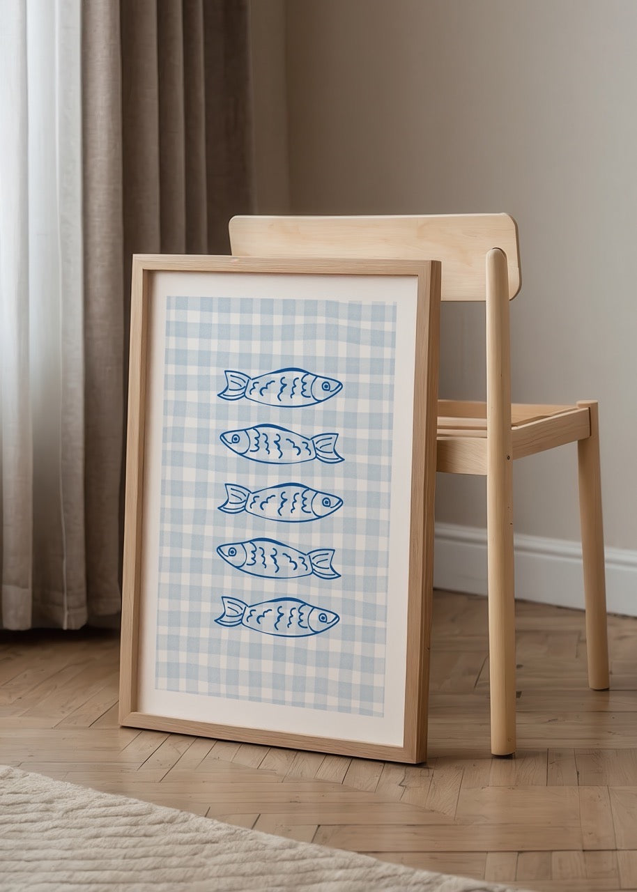 Artwork featuring sardines on a blue gingham background.