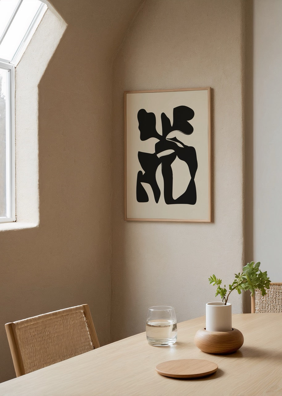 Monochrome abstract artwork with bold black shapes on cream background.