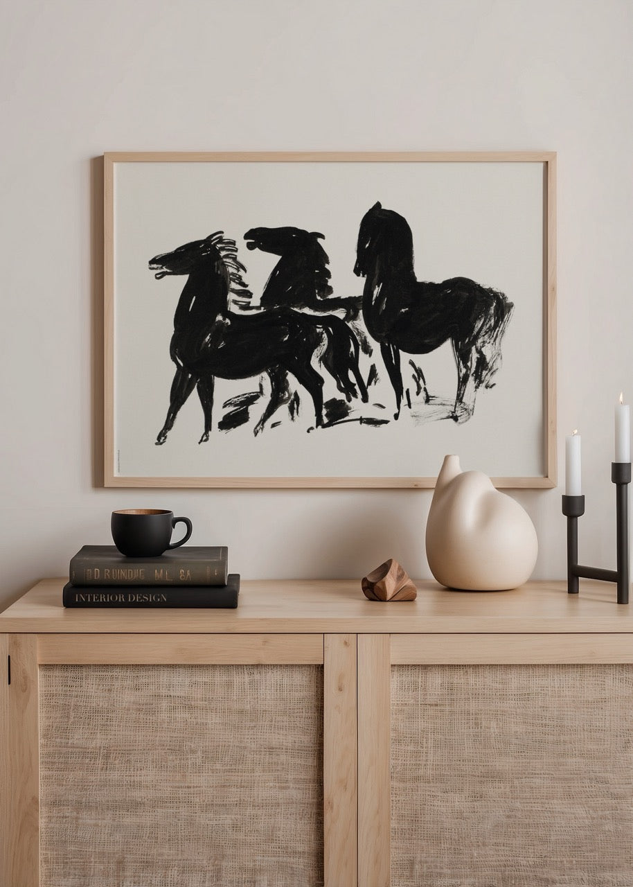Abstract artwork of three majestic black horses in motion.