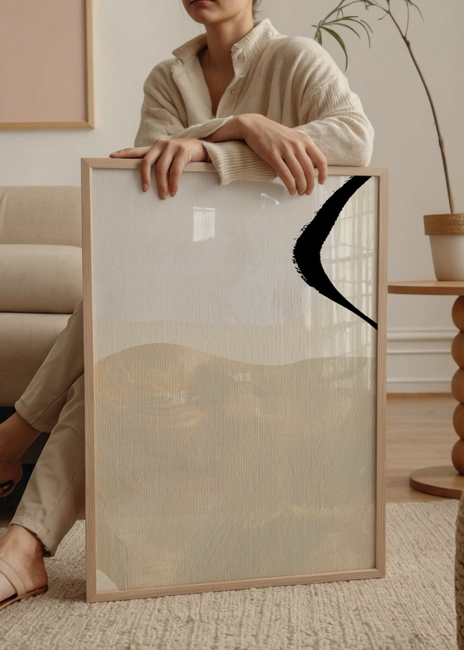 Artistic brushstroke wall art in neutral tones, featuring beige and black.