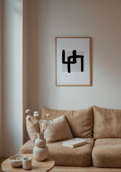 Bold brushstroke abstract wall art in black on a neutral background.