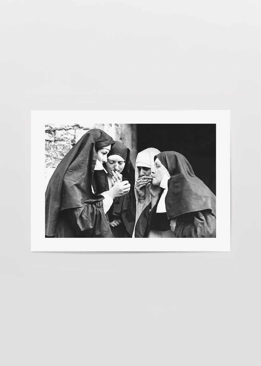 Vintage photograph of nuns sharing a moment, perfect for wall art.
