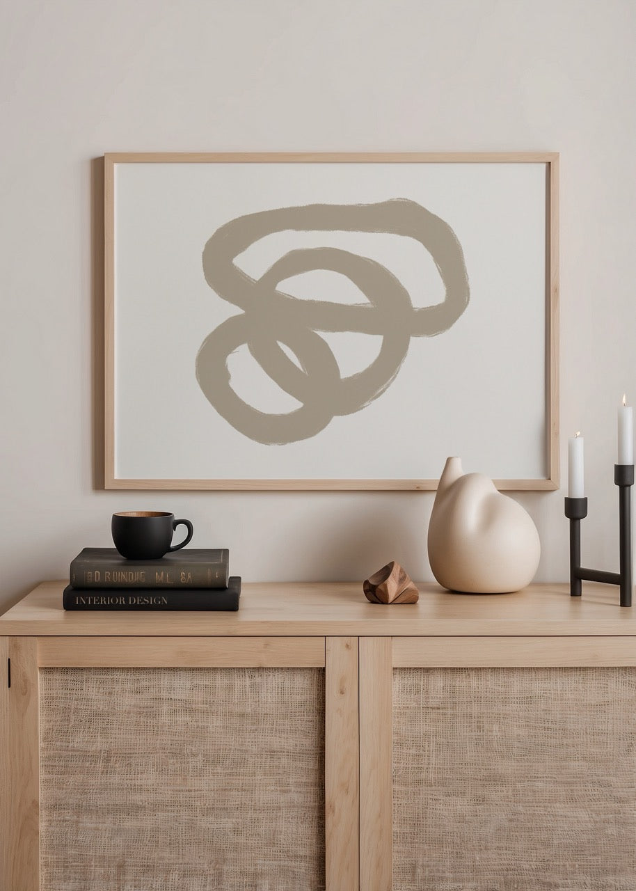 Abstract wall art featuring soft, organic loops in neutral tones.