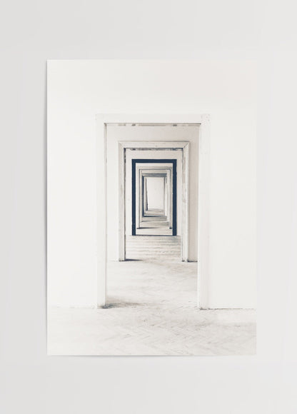 A minimalist black and white print depicting endless doorways.
