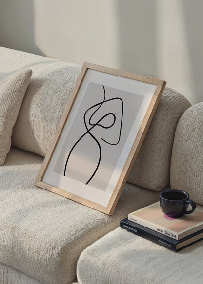 Abstract line art print on beige background showcasing fluid shapes.