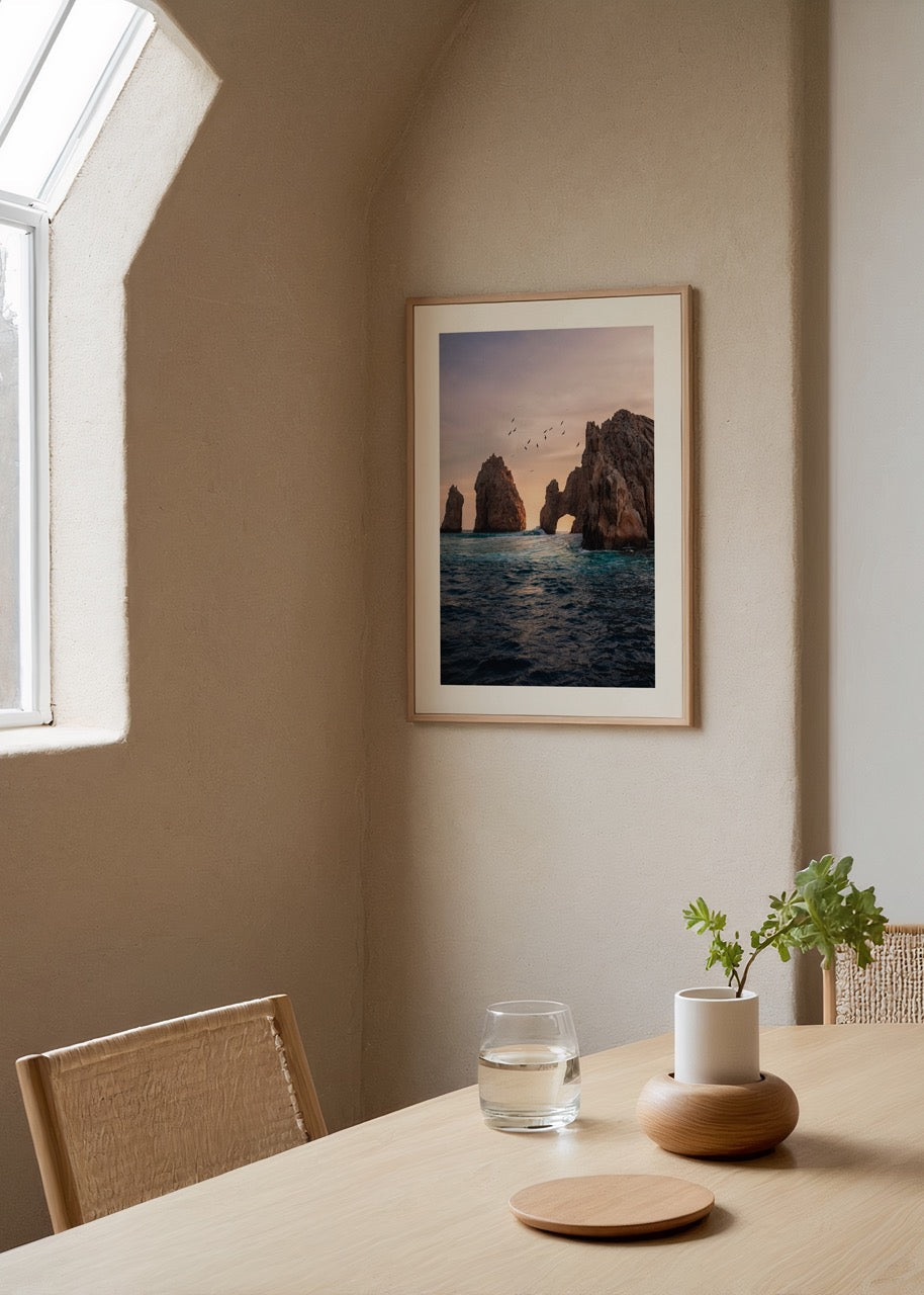 Serene sunset over an ocean arch capturing tranquil views.