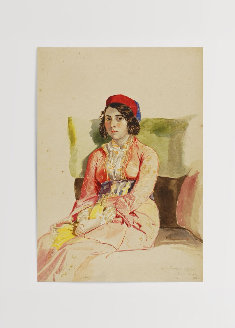A Turkish girl in traditional attire seated gracefully, evoking elegance.