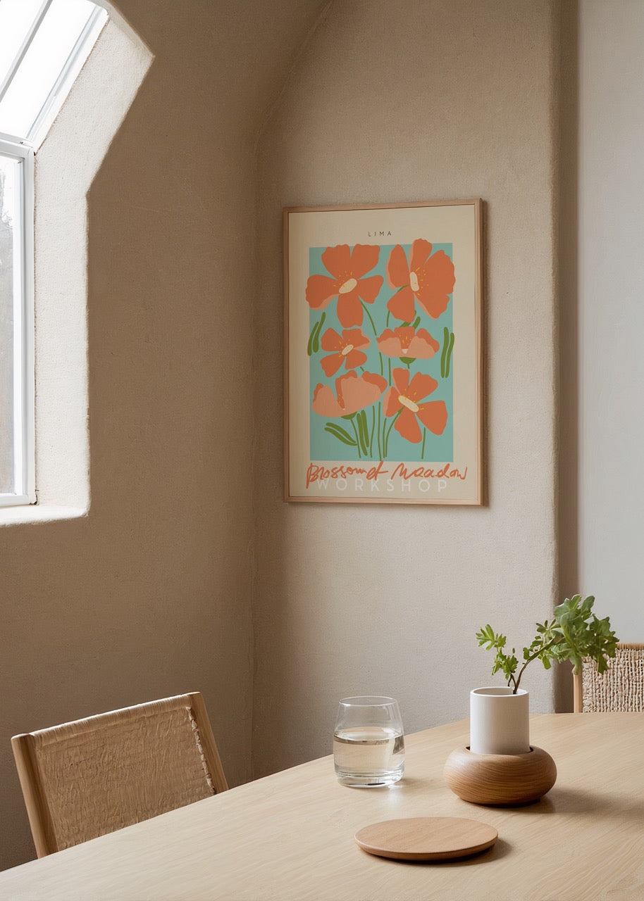 Vibrant floral art print featuring orange flowers on a blue background.