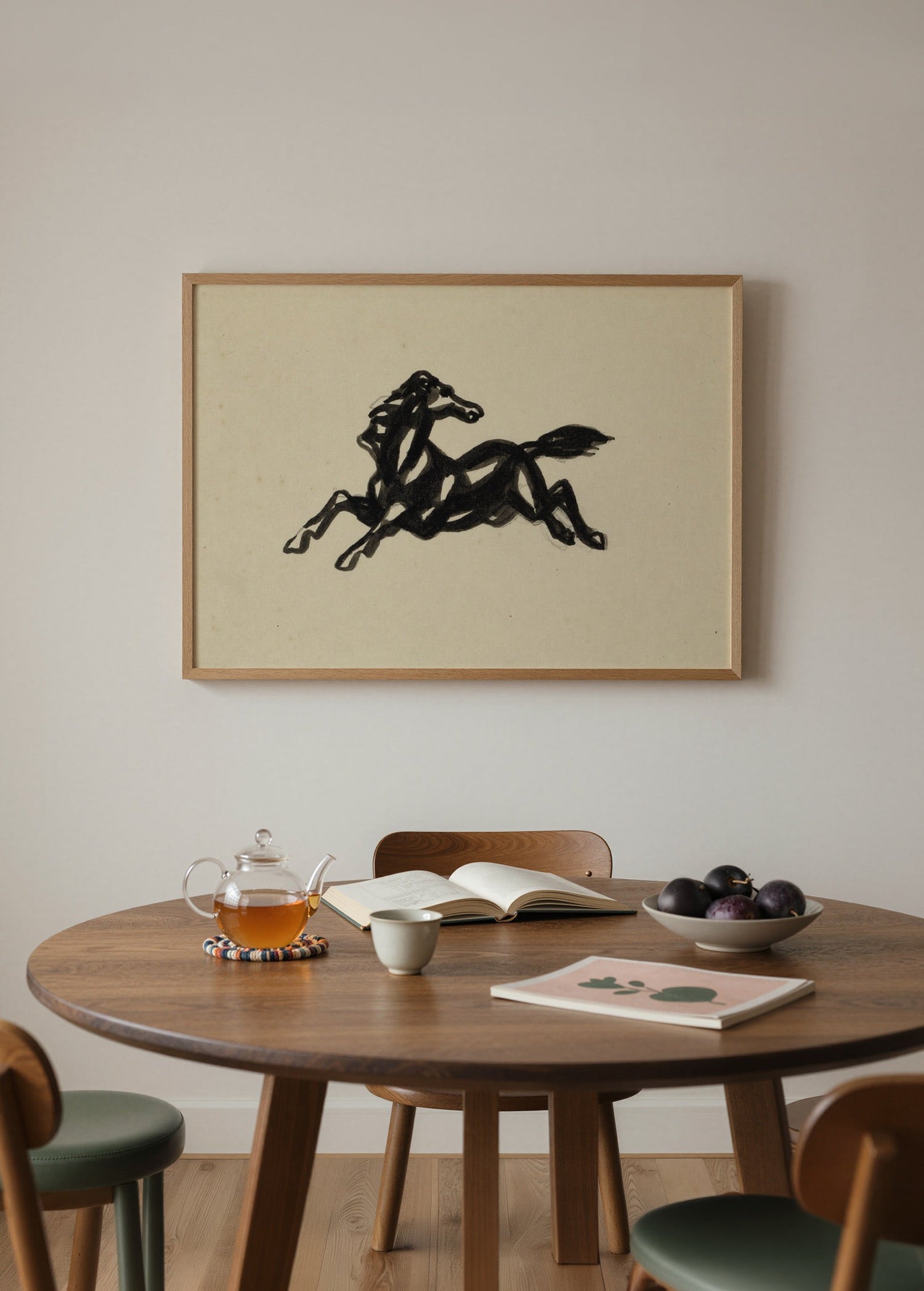 A dynamic black silhouette of a galloping horse on beige background.