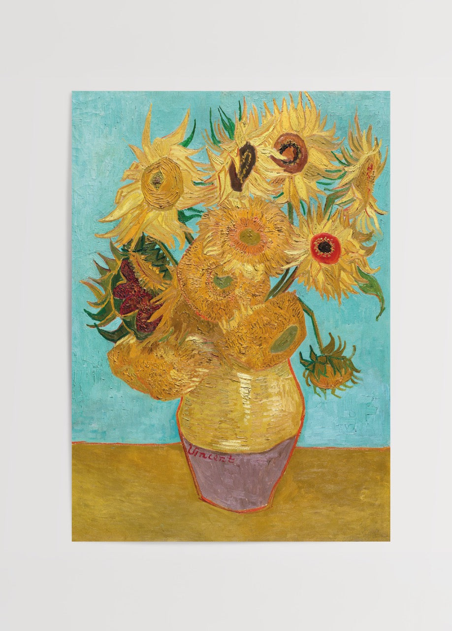 Vibrant sunflowers in a vase against a turquoise background