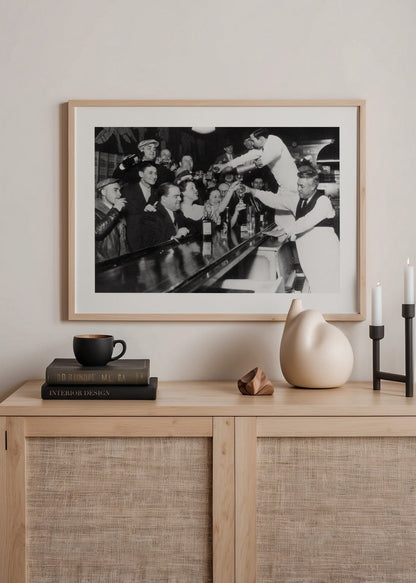 Vintage black and white print of a bustling bar scene.