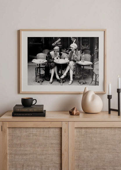 Vintage black and white photograph of two women at a Paris café.