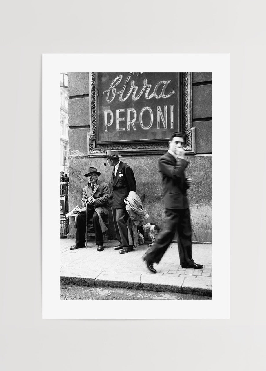Black and white street scene poster art featuring figures and vintage signage.