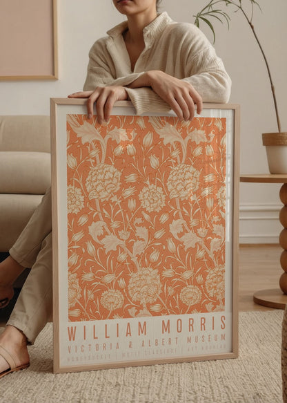 Floral wall art featuring intricate honeysuckle patterns in warm tones.