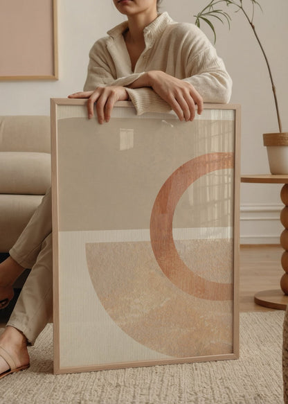 Abstract wall art featuring soft curves and neutral tones.
