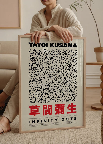 Yayoi Kusama Infinity Dots Poster featuring bold black dots on a white background.