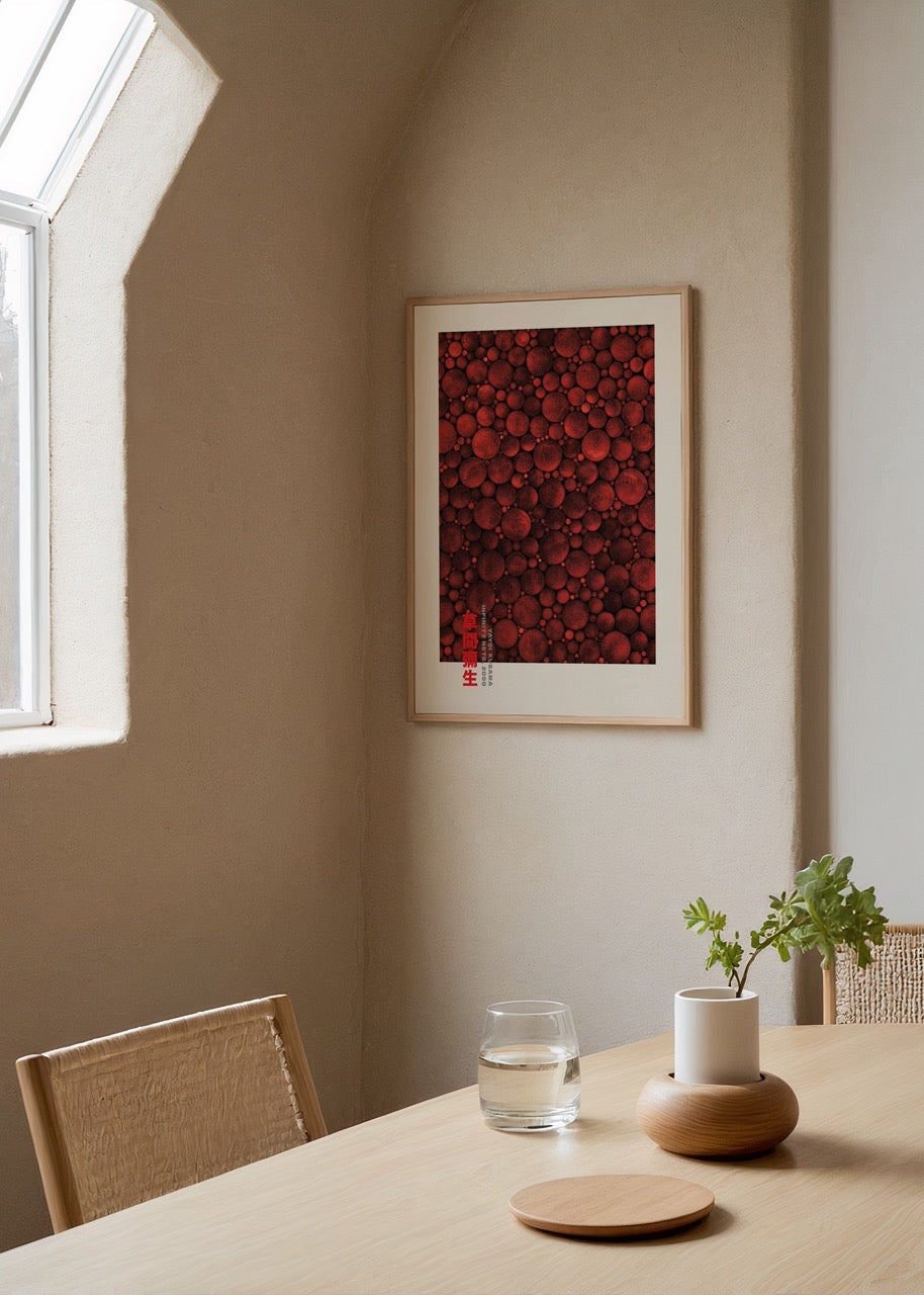 A vibrant wall art piece featuring an array of red dots in various sizes.