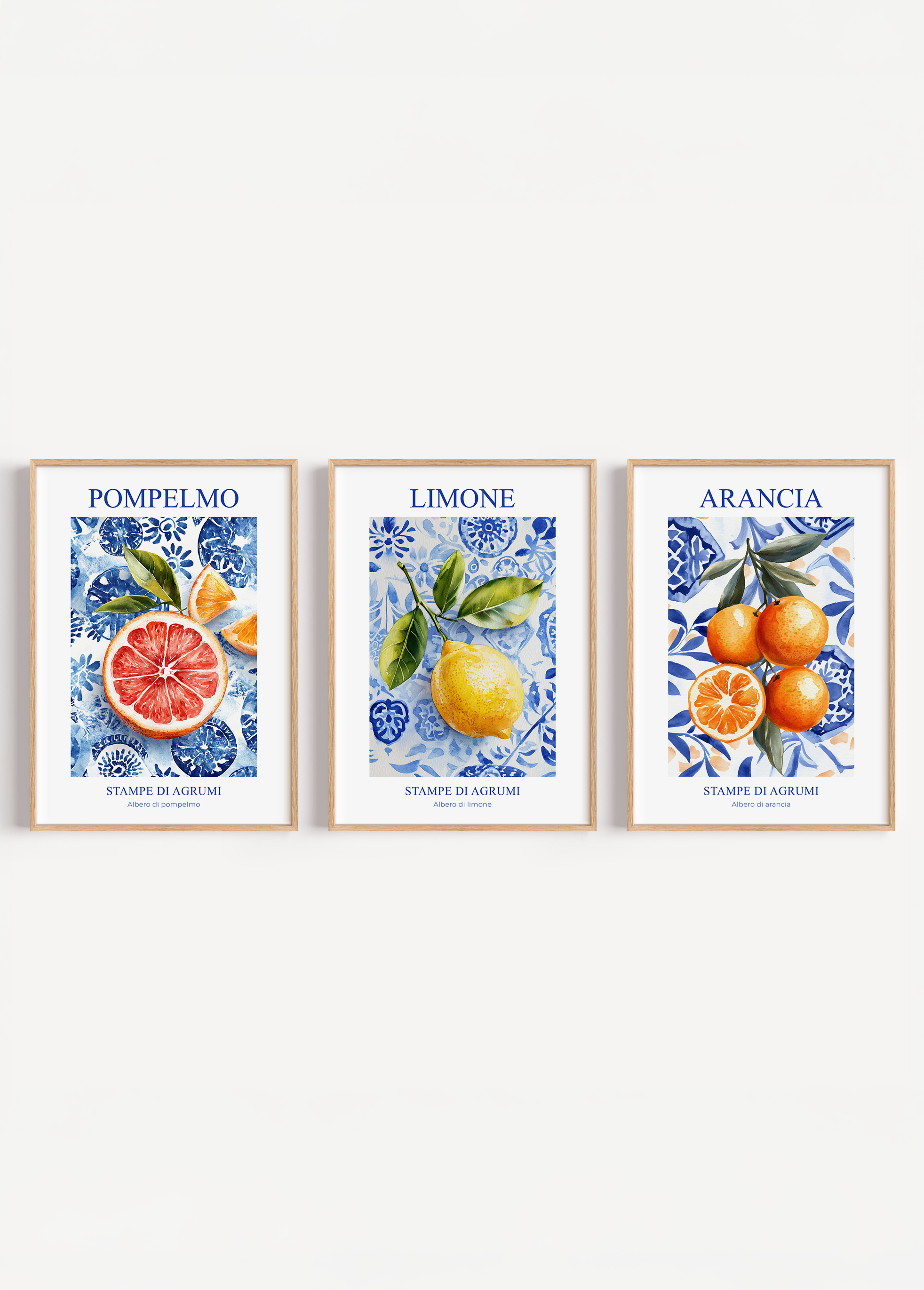 Three-piece poster set featuring grapefruit, lemon, and orange illustrations on a floral blue background.